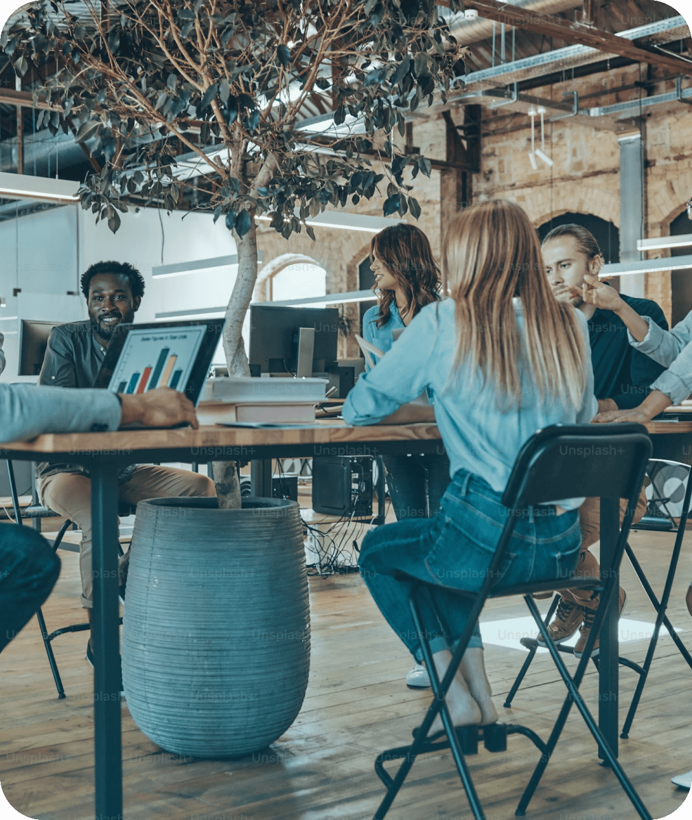 Diverse team collaborating in a modern office workspace